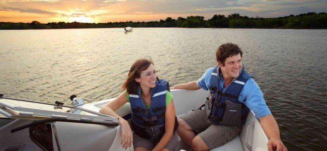 Man and Woman on boat over Lake