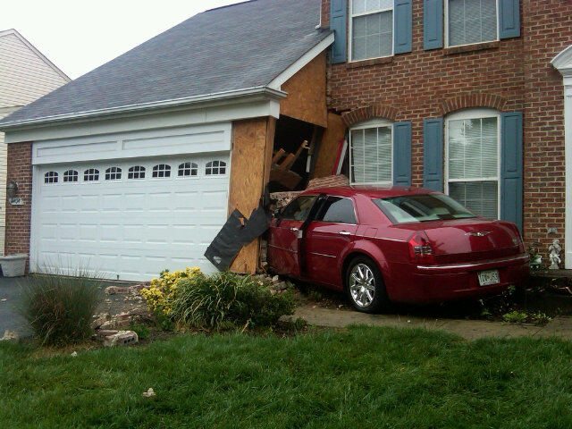 Red Car Crash into house
